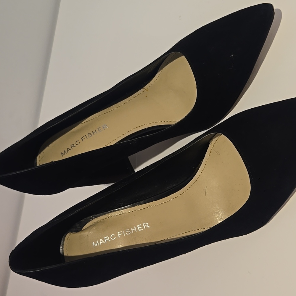 Up for grabs are these super cute size 7.5 Marc fisher black heels. Gently worn